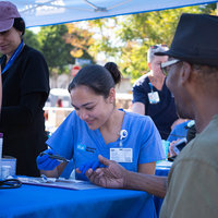 A UCLA nrusing student providing a health screening