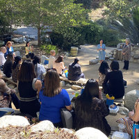A photograph of DNP students, alumni and faculty at the Botanical Garden 