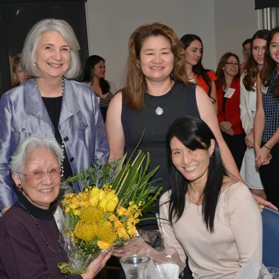 Helen Shishino (seated) with Dean Linda Sarna and daughters Laurie Shishino (seated right) and Linda Shishino-Cruz
